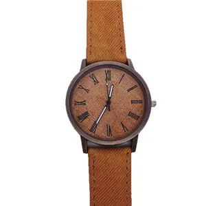 Vintage bronze quartz watch featuring a tan denim texture dial and strap with roman numerals