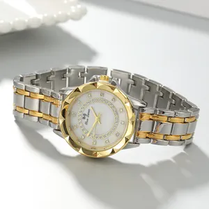 Close-up of elegant two-tone ladies' quartz watch with rhinestone-studded dial