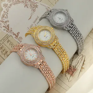 Detail view of three rhinestone studded quartz watches in gold, rose gold and silver.