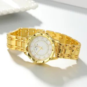 Detailed close-up of a gold stainless steel women's watch with a crystal-encrusted dial.
