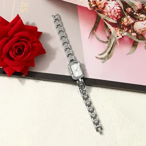 Silver square dial ladies quartz watch presented with elegant red rose and floral props