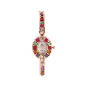 Montre pour femme en or rose tendance avec incrustation de pierres précieuses colorées