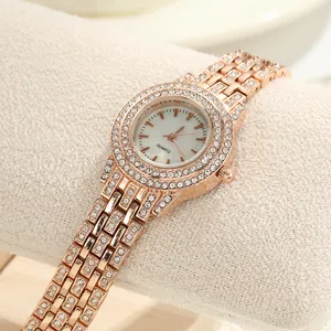 Elegant rose gold ladies quartz watch featuring shimmering rhinestones and a slim strap