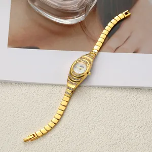 Detailed view of a vintage gold bracelet watch for women with rhinestone accents