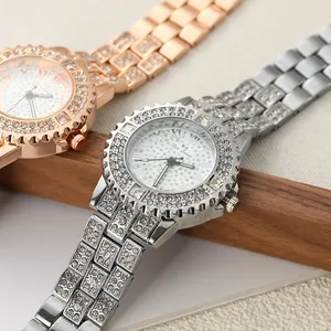 Detailed view of silver and rose gold luxury rhinestone watches on wooden display
