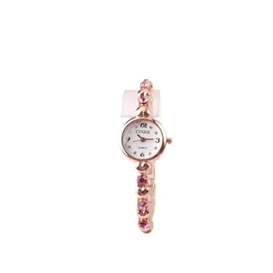 Elegant rose gold women's bracelet watch with pink crystals and a small white dial