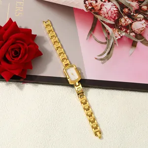 Detail view of a luxury gold-tone square ladies quartz watch with an elegant link bracelet