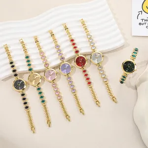 Elegant gold ladies' quartz bracelet watch with colorful rhinestone gemstone accents