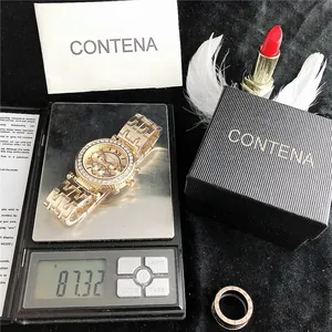 Gedetailleerde gewichtsmeting van een gouden dameshorloge met strass op 87,32 g