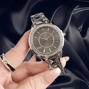 Macro view of a vintage women's watch with a diamond-encrusted bezel and grey dial