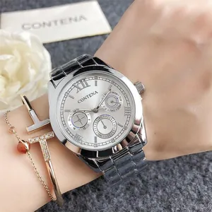 Detail of silver business quartz watch with three functional sub-dials on a wrist
