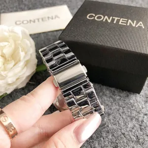 Macro detail of silver stainless steel watch strap and secure deployment clasp
