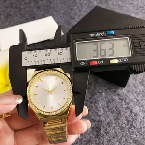 Rose gold women's watch with diamond bezel being measured with digital caliper, 36.3mm size