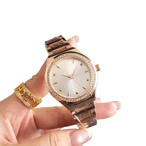 Elegant rose gold ladies' watch featuring a white dial and a luxury rhinestone-encrusted bezel