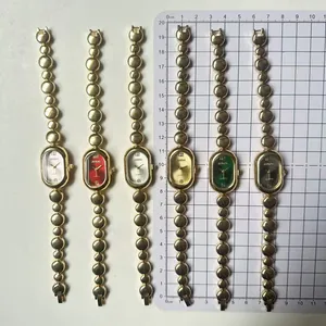 Vintage gold bean link oval quartz watch set in multiple colors shown on metric scale