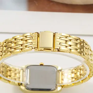 Detail view of a gold stainless steel watch band clasp and rectangular case back.