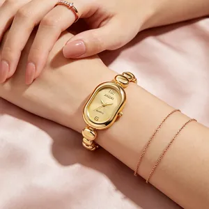 Detailed view of women's gold oval watch featuring a stylish bean chain bracelet