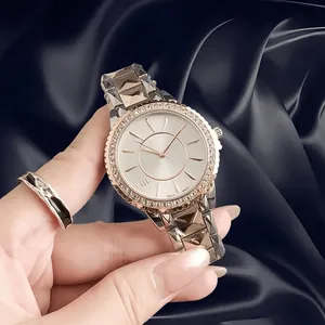 Macro view of elegant women's watch with a sparkling rhinestone bezel and silver dial
