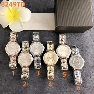 Selection of six women's watches with studded metal straps and elegant crystal bezels.