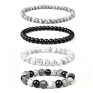 Set of four natural stone beaded bracelets including white turquoise and black onyx