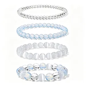Detail showing four healing crystal beaded bracelets with blue and white stone beads.