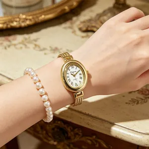 Elegante ovale Vintage-Quarzuhr für Damen mit goldenem Armband und feinem Perlendetail