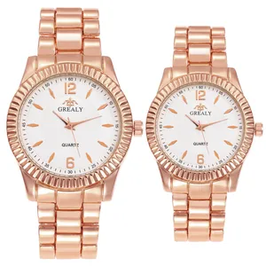 Parure de montres à quartz en or rose pour couple avec cadran blanc et bracelet acier