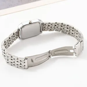 Detailed view of the silver stainless steel strap and back case of the women's watch