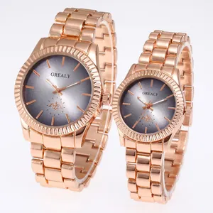 Detailed view of rose gold stainless steel couple watches with grey gradient dials