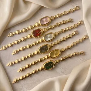 Luxury gold pebble chain oval ladies quartz watch in vintage minimalist style for women