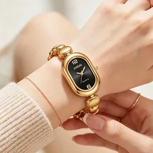 Elegant vintage gold oval quartz watch with unique bean link bracelet for women