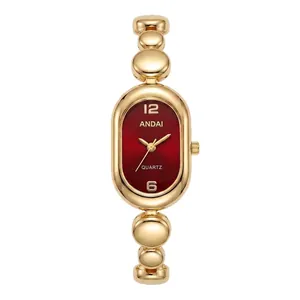 Elegant minimalist gold bean chain bracelet watch with oval red dial for stylish women