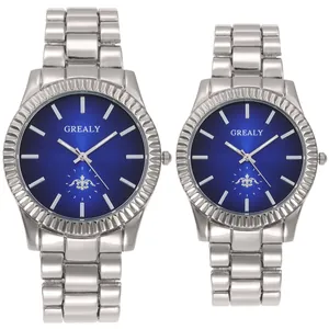 Pair of couple wristwatches with silver steel straps and blue dials, quartz movement.