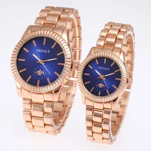 Elegant rose gold couple watch set with deep blue sunburst dials and steel bands