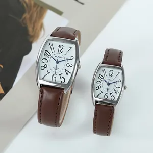 Detailed close-up of XAPWV business style couple watches with brown leather straps