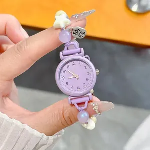 Detailed shot of a purple beaded bracelet watch for students with a cute star charm