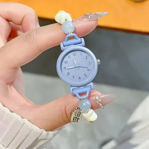 Cute light blue beaded bracelet watch for students with star charms and analog dial.