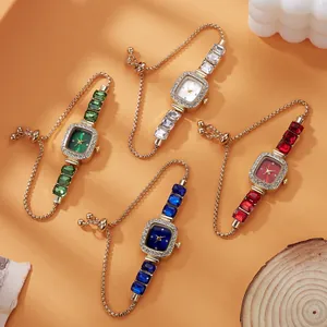Four luxury square quartz watches with colorful gemstone bracelets on a warm background