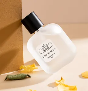 Close-up view of Flowerbasis Lemon White Tea Eau de Parfum bottle with dry flower petals