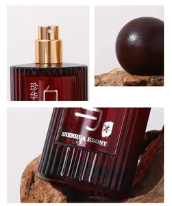 Macro details of the Zhenhua Ebony sandalwood perfume bottle texture and spray nozzle.