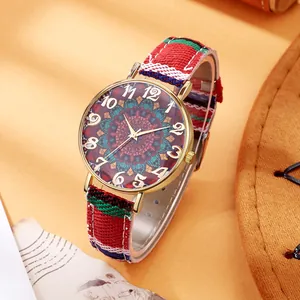 Macro detail of bohemian vintage women quartz watch with a colorful canvas strap