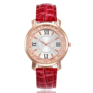 Close-up detail of elegant rose gold quartz watch featuring a red crocodile pattern strap