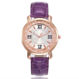 Detail view of rose gold women's watch with purple faux leather strap and crystal bezel