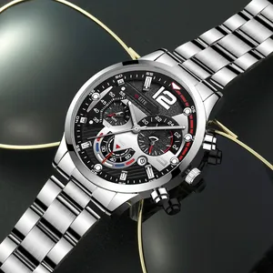 Close-up of men's steel band watch with luminous hands and date display on a dark background