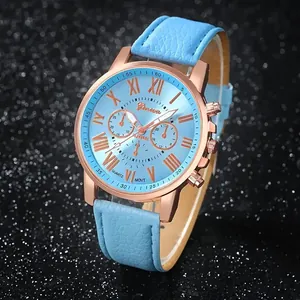 Macro view of light blue Geneva women's watch with rose gold bezel and Roman numerals