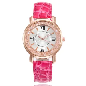 Detailed view of rose gold women's watch with pink crocodile strap and rhinestones