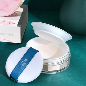 Poudre libre fixatrice imperméable avec houppette douce pour un maquillage durable