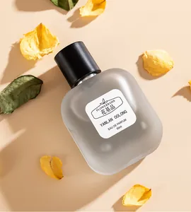 Close-up of Flowerbasis Yanlan Oolong perfume bottle with scattered yellow petals.