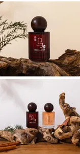 Detailed shot of woody perfume bottles on rustic wood, Ebony and Sandalwood scents