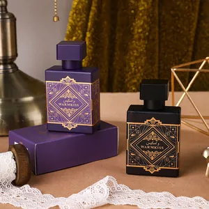 Luxury Arabic men's oud perfume bottles with gold geometric patterns in purple and black.